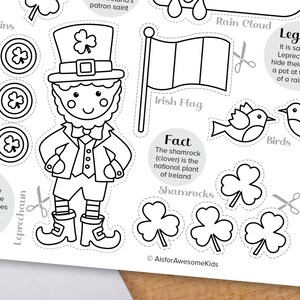 May include: Black and white printable coloring page featuring a leprechaun, shamrocks, birds, a rain cloud, and an Irish flag. The page includes the text "Fact: The shamrock (clover) is the national plant of Ireland."