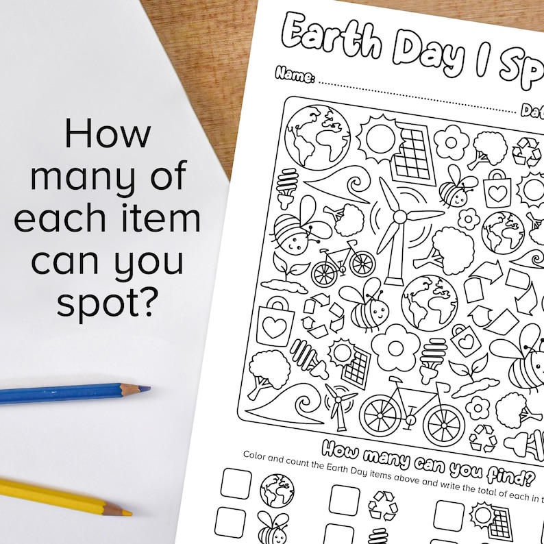 May include: A black and white printable Earth Day I Spy activity sheet.  The sheet features a variety of Earth Day themed images including bees, flowers, trees, bicycles, windmills, solar panels, light bulbs, recycling symbols, and the Earth.  The text on the sheet reads "How many can you find?" and "Color and count the Earth Day items above and write the total of each in the boxes below."