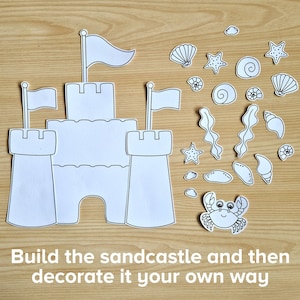 May include: A black and white printable sandcastle craft with flags, seashells, starfish, seaweed, and a crab. Build the sandcastle and then decorate it your own way.