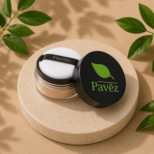 May include: A clear jar of loose powder with a white puff and a black lid. The lid is off to the side, revealing the powder and the puff. The lid has the word "Pavez" in green, with a green leaf logo. The puff has the word "Pavez" on a black band.