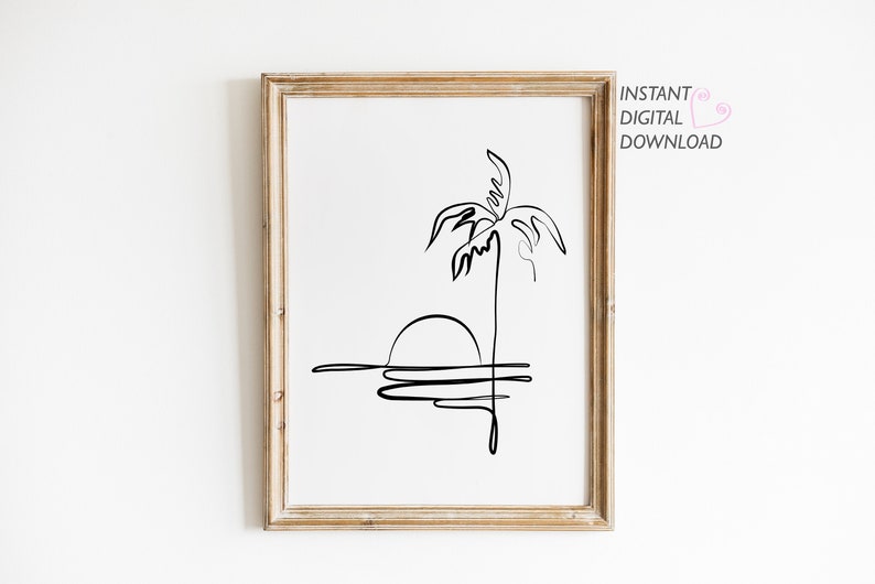 Puede incluir: Un dibujo en blanco y negro de una palmera y una puesta de sol sobre el agua. El dibujo est&aacute; enmarcado en un marco de madera clara.