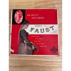 May include: A square vintage record album cover for Gounod's Faust by the New York City Opera Company. The red and white cover features an illustration of a woman in a long dress holding flowers, with text listing the cast and MGM 45 RPM logo.