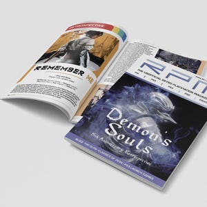 May include: A magazine cover featuring a blue and white image of a knight in armour with the text "Demon's Souls 15th Anniversary Retrospective" and "The Unofficial Retro Playstation Magazine" on the cover.