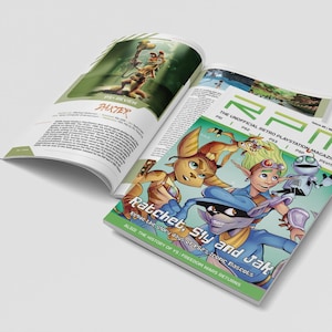 May include: An open magazine featuring a colorful cover with the text "Ratchet, Sly and Jak" and "RPM The Unofficial Retro Playstation Magazine". The magazine has illustrations of video game characters. Another page shows a review of "PAXTER".
