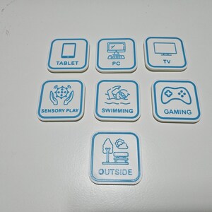 May include: Seven square white tiles with rounded corners, each featuring a blue border and a blue line-art icon with text. The icons represent a tablet, PC, TV, sensory play, swimming, gaming, and outside, with corresponding labels below each.