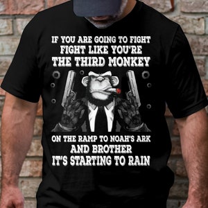 May include: Black t-shirt with a graphic of a monkey wearing a suit and holding two guns. The text on the shirt reads "If you are going to fight fight like you're the third monkey on the ramp to Noah's ark and brother it's starting to rain."