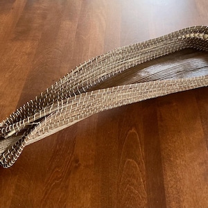 Pine Needle Coiled Basket On A Palm Sheath.
