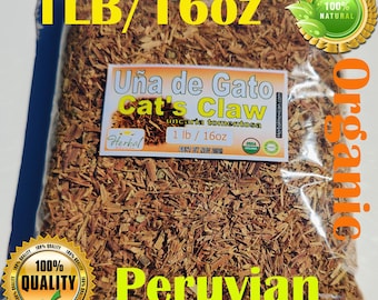 May include: A clear plastic bag filled with brown, shredded Cat's Claw bark, labeled Uña de Gato Cat's Claw Uncaria tomentosa, 1 lb / 16 oz. The packaging features text including 1LB/16oz, Organic, Peruvian, and 100% Quality, with a USDA Organic seal.