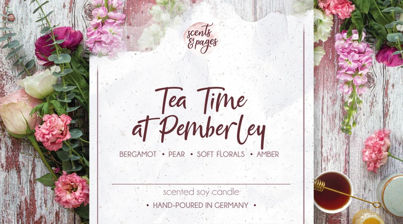 May include: A white card with the text "Tea Time at Pemberley" in maroon script. The card is surrounded by pink and white flowers and greenery. The text "scented soy candle" and "HAND-POURED IN GERMANY" is also on the card. The candle is scented with bergamot, pear, soft florals, and amber.