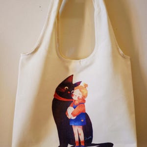Jolie fille et sac fourre-tout pour chat avec fermeture à glissière et poche intérieure