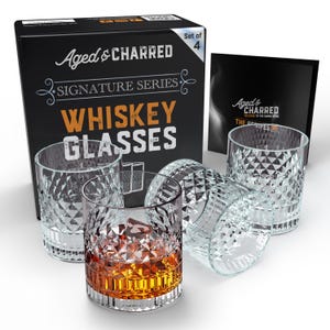 May include: Set of four clear, diamond-patterned whiskey glasses in a box. The box is black with white text that reads "Aged & Charred Signature Series Whiskey Glasses" and "Set of 4".