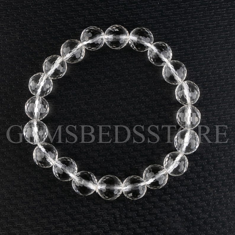 May include: A clear crystal bracelet with faceted beads. The bracelet is made of natural quartz and is approximately 7 inches in length.