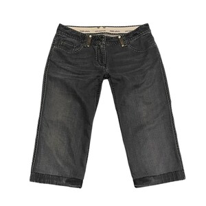 May include: Dark gray denim capri pants featuring a mid-rise waist, a button and zipper fly closure, and decorative stitching along the pockets and side seams. The interior waistband displays the text Fendi Selleria in a repeating pattern.