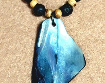 Shell pendant with lava bone and wood