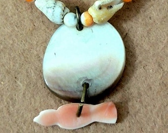 Mother of pearl button pendant with bird