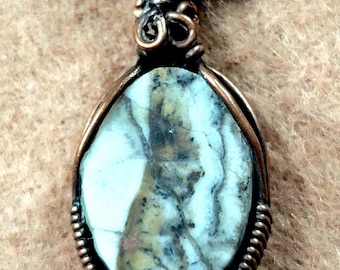 Silver Lace onyx pendant with reed bone and seed