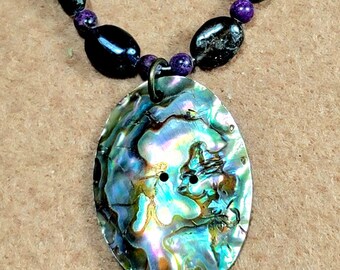 Opalescent Mother of Pearl pendant: Highlighted by the deep rich color of Sugilite and the flashing chatoyance of labradorite