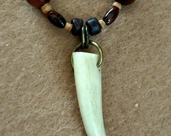 Antler point: mahogany obsidian, red tiger eye, shell, bone and Reed.