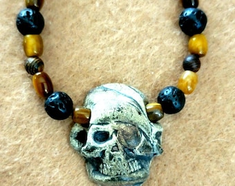 Skull: Bone, tiger eye, lava and wood