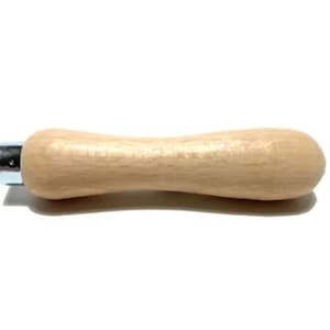 May include: A light-colored wooden handle with a metal fitting on one end. The handle has a rounded, ergonomic shape, and is designed for use with a tool or implement. The handle is made of natural wood.