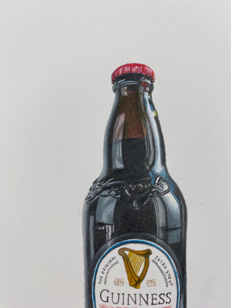 May include: A dark brown Guinness stout beer bottle with a red cap. The bottle has a white label with a gold harp and the Guinness logo. The words "The Original" and "Extra Stout" are also visible.