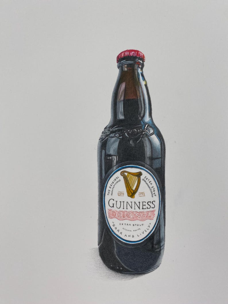 May include: A dark stout Guinness beer bottle with a red cap. The label reads "Guinness Original Extra Stout" with a gold harp emblem. The bottle is dark with a glossy finish.