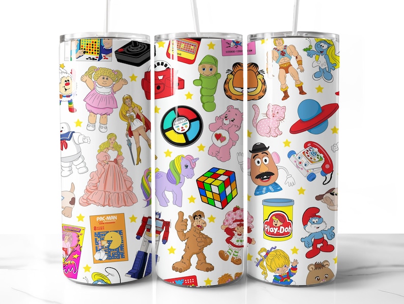 May include: White tumbler featuring a colourful pattern of 1980s cartoon characters and toys, including Pac-Man, Care Bears, My Little Pony, Play-Doh, and Mr. Potato Head.
