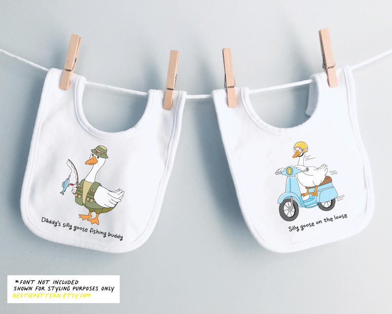 May include: Two white bibs with different designs. One bib features a cartoon goose wearing a fishing hat and holding a fishing rod. The text on the bib reads "Daddy's silly goose fishing buddy". The other bib features a cartoon goose riding a blue scooter. The text on the bib reads "Silly goose on the loose".
