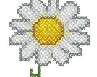 May include: A white daisy with a yellow center and a green stem. The daisy is a simple, classic flower.