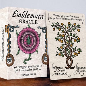 May include: The Emblemata Oracle deck box and a single card featuring a tree with golden apples. The box displays a pink flower, a green insect, and a key entwined with a snake. The card features the text Hortus Hesperidum patet the garden of the Hesperides lies open and Beyond the Dragon Golden Apples.