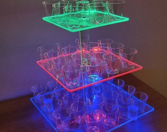 Illuminated Shot stand 3 tier party centrepiece.  Fading, Flashing or static RGB lights. Rechargable and reusable light up. Birthday Wedding