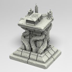 May include: A grey stone altar with a book on top and three candles. The altar is decorated with vines and has a square base.