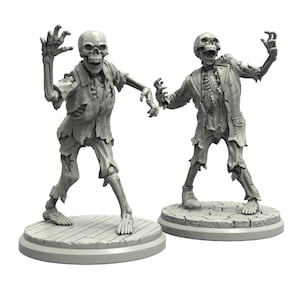 May include: Two grey painted skeletal figures with tattered clothing, standing on round bases. The figures are posed in a walking motion with their arms outstretched.