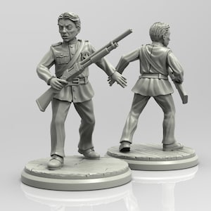 May include: A grey plastic miniature figurine of a soldier in a military uniform holding a rifle. The figurine is standing on a round base.
