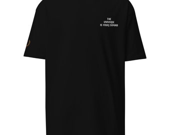 May include: Black t-shirt with short sleeves and a white graphic print that says "THE UNIVERSE IS YOUR EXPAND".