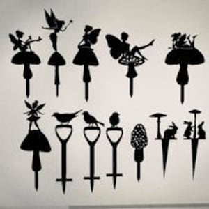 yard stakes fairies mushrooms and birds