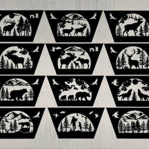 May include: A set of 18 black metal fire pit screens with various wildlife designs. Each screen features a different animal silhouette, including deer, elk, moose, wolves, and bears, set against a backdrop of trees and a full moon. The screens are designed to fit over a fire pit, adding a decorative touch and preventing sparks from flying out.