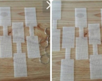 May include: A set of white plastic mesh squares with a small hole in the center of each square. The squares are arranged in a grid pattern and are used for crafting.