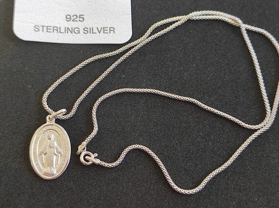 Medaglietta Madonna con caucciù. Icona a rilievo - Articoli Religiosi Shemà