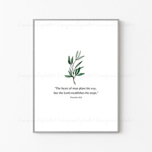 May include: A printable wall art design featuring a watercolor illustration of a green leafy branch with the quote "The heart of man plans his way, but the Lord establishes his steps." Proverbs 16:9