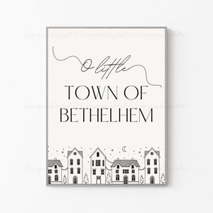 Pode incluir: Impressão de arte imprimível em preto e branco com o texto "O little town of Bethlehem" e uma ilustração simples de uma cidade com casas e estrelas.