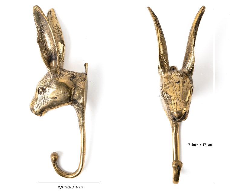 May include: A pair of gold metal rabbit head hooks. The hooks are 7 inches tall and 2.5 inches wide.