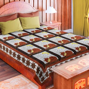 May include: A brown and white quilt with a pattern of squirrels sitting on branches. The quilt is on a bed with a brown wooden headboard and a yellow pillow. The quilt has a brown and white border with stars.