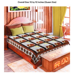 May include: A queen-sized quilt with a brown and white patchwork design featuring a sleeping cat motif. The quilt is displayed on a bed with brown and beige pillows. The quilt is made by Lancaster County Quilting Creations. "THIS PATTERN IS COPYRIGHT BY LANCASTER COUNTY QUILTING CREATIONS 2018. ALL RIGHTS RESERVED."
