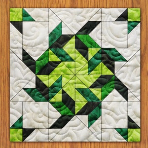 May include: A quilt block with a geometric design featuring black, green, and white triangles. The design is a repeating pattern of triangles that create a starburst effect.