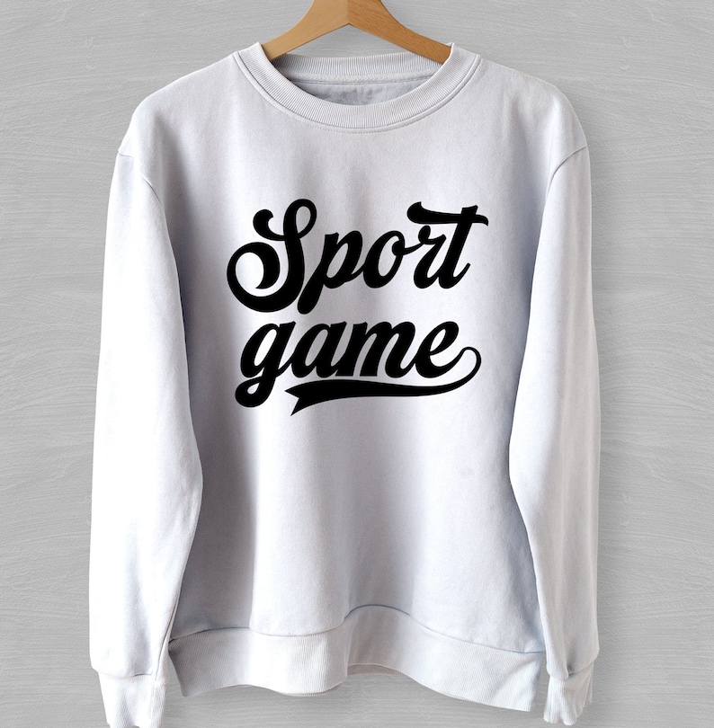 May include: White sweatshirt with black text that reads "Sport game" in a retro font.