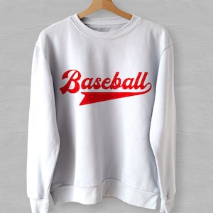 May include: White sweatshirt with a red "Baseball" graphic in a vintage style font.