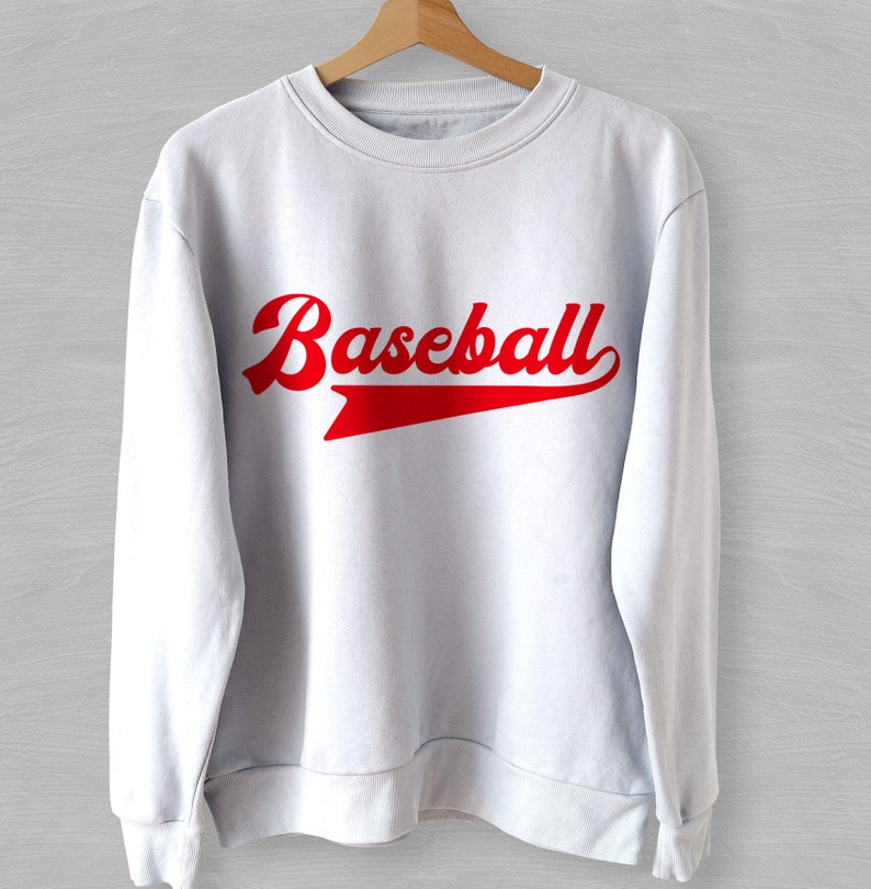 May include: White sweatshirt with a red "Baseball" graphic in a vintage style font.