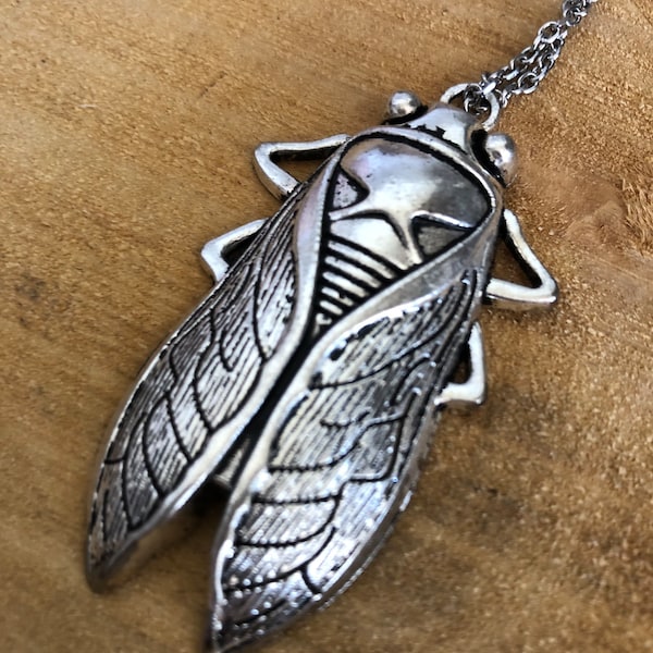 Silver Tone cicada necklace with stainless steal cable chain.