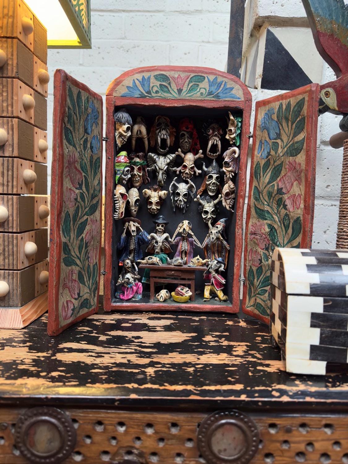 Claudio Jimenez Quispe retablo of miniature skeleton mask figures made of potato dough, Day of the dead.  Made in Peru. Folkart.